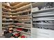 Walk-in closet with custom shelving and storage solutions for shoes and accessories at 1149 Ansel Nw Ln, Atlanta, GA 30318