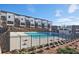 Upscale community pool surrounded by modern townhomes and lush landscaping at 1149 Ansel Nw Ln, Atlanta, GA 30318