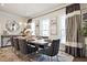 Elegant dining room with a stylish table setting, modern lighting, and sophisticated decor at 1149 Ansel Nw Ln, Atlanta, GA 30318