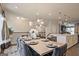 A bright dining space next to an island and stairs is set for a feast at 1149 Ansel Nw Ln, Atlanta, GA 30318