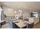 Open concept dining area boasts modern lighting and flows into a spacious open area at 1149 Ansel Nw Ln, Atlanta, GA 30318