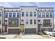 Modern townhomes with colorful front doors and a well maintained landscaped yard at 1149 Ansel Nw Ln, Atlanta, GA 30318