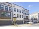 Beautiful townhome exterior with a gray garage, yellow front door, and classic brick and siding details at 1149 Ansel Nw Ln, Atlanta, GA 30318