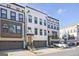 Modern townhome with a yellow front door, gray garage door, and beautiful architectural details at 1149 Ansel Nw Ln, Atlanta, GA 30318