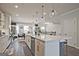 The open-concept kitchen island has seating and stainless steel appliances nearby at 1149 Ansel Nw Ln, Atlanta, GA 30318