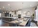 Elegant kitchen and dining space showcasing granite counters, stainless appliances, and chic pendant lighting at 1149 Ansel Nw Ln, Atlanta, GA 30318