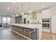 Bright modern kitchen featuring a large island, barstool seating, and stainless steel appliances at 1149 Ansel Nw Ln, Atlanta, GA 30318