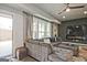 Comfortable living room featuring a large sectional sofa, ceiling fan, and stylish decor at 1149 Ansel Nw Ln, Atlanta, GA 30318