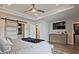 Spacious main bedroom features a barn door leading to a closet and a flat-screen TV above a dresser at 1149 Ansel Nw Ln, Atlanta, GA 30318