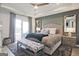 Serene main bedroom featuring a plush bed, tray ceiling, and ensuite bath at 1149 Ansel Nw Ln, Atlanta, GA 30318