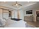 Spacious main bedroom with walk-in closet, tray ceiling, and ceiling fan at 1149 Ansel Nw Ln, Atlanta, GA 30318