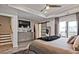 Bright and airy main bedroom featuring a TV, closet and a private balcony offering an ideal retreat at 1149 Ansel Nw Ln, Atlanta, GA 30318