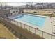 Community pool surrounded by manicured landscaping and a modern clubhouse at 1149 Ansel Nw Ln, Atlanta, GA 30318