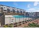 View of the community pool and surrounding townhomes with rear decks and secure fencing at 1149 Ansel Nw Ln, Atlanta, GA 30318