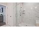 An elegant shower with marble-look tiles, glass enclosure, and dual shower heads at 1149 Ansel Nw Ln, Atlanta, GA 30318