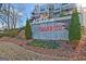 Community entrance sign for Altus at the Quarter, featuring colorful flower bed landscaping at 1149 Ansel Nw Ln, Atlanta, GA 30318