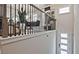 Open staircase with dark wood trim, modern black metal railings and a view of the dining area at 1149 Ansel Nw Ln, Atlanta, GA 30318