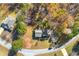 Aerial view of the home, showcasing its placement in a tranquil, tree-lined neighborhood at 120 Aspen Forest Dr, Covington, GA 30016