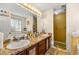 Bathroom featuring marble counter tops, dual sink, mirror, tile floors and lots of counter space at 120 Aspen Forest Dr, Covington, GA 30016