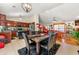 Open-concept dining area adjacent to the kitchen, featuring a dining table with seating and plenty of natural light at 120 Aspen Forest Dr, Covington, GA 30016