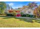Charming single-Gathering home featuring a well-maintained lawn and a welcoming front porch with a decorative door at 120 Aspen Forest Dr, Covington, GA 30016