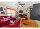 Cozy living room with a brick fireplace, warm lighting, and comfortable seating, creating a welcoming atmosphere at 120 Aspen Forest Dr, Covington, GA 30016