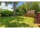 Expansive backyard with green grass, mature shade tree, and privacy fence at 259 Sisson Ne Ave, Atlanta, GA 30317