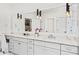 Bright bathroom with dual sinks, white marble countertops, and modern light fixtures at 259 Sisson Ne Ave, Atlanta, GA 30317