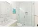 Modern bathroom featuring a glass-enclosed shower with white subway tiles and a sleek vanity with chrome fixtures at 259 Sisson Ne Ave, Atlanta, GA 30317