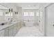Luxurious bathroom with dual vanity, soaking tub, and glass shower at 259 Sisson Ne Ave, Atlanta, GA 30317