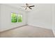 Bright, empty bedroom with neutral carpet, a ceiling fan, and a window offering natural light at 259 Sisson Ne Ave, Atlanta, GA 30317
