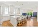 Modern kitchen boasts an island with bar seating, stainless steel appliances, and pendant lighting at 259 Sisson Ne Ave, Atlanta, GA 30317