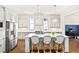 Spacious kitchen with stainless steel appliances, a large island, and pendant lights, perfect for entertaining at 259 Sisson Ne Ave, Atlanta, GA 30317
