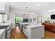 Open concept: Kitchen with island flows into living and dining areas, perfect for entertaining and Gathering gatherings at 259 Sisson Ne Ave, Atlanta, GA 30317