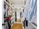Spacious walk-in closet with custom shelving and ample hanging storage on both sides at 259 Sisson Ne Ave, Atlanta, GA 30317