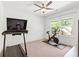 Bright workout room featuring a treadmill and stationary bike with a ceiling fan and natural light at 259 Sisson Ne Ave, Atlanta, GA 30317