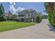 Beautiful backyard with a lush lawn and a large house with a screened-in porch at 3735 Duckcove Way, Cumming, GA 30041