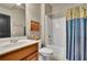 Bathroom with a shower and tub combination, and a wood vanity at 3735 Duckcove Way, Cumming, GA 30041