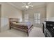 Comfortable bedroom with natural light, carpeted floors, and built in wall trim at 3735 Duckcove Way, Cumming, GA 30041