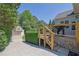 Spacious wooden deck featuring an outdoor grill and beautiful yard at 3735 Duckcove Way, Cumming, GA 30041