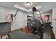 Home gym with hardwood floors and a variety of workout equipment at 3735 Duckcove Way, Cumming, GA 30041