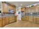 Gourmet kitchen with custom wooden cabinets, granite countertops, and built-in appliances at 3735 Duckcove Way, Cumming, GA 30041