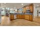 Open kitchen with wooden cabinets, granite countertops, and modern stainless steel appliances at 3735 Duckcove Way, Cumming, GA 30041