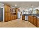 Well-equipped kitchen featuring stainless steel appliances, granite countertops, and wood cabinets at 3735 Duckcove Way, Cumming, GA 30041