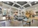 Bright living room featuring a coffered ceiling, tile flooring, and backyard views at 3735 Duckcove Way, Cumming, GA 30041