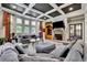 Inviting living room boasts fireplace, backyard views and comfortable seating arrangement at 3735 Duckcove Way, Cumming, GA 30041
