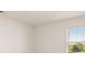 Bright bedroom with a large window, neutral carpet, and white trim at 5430 Flat Rock Pt, Stonecrest, GA 30038