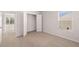 Neutral bedroom with large window and closet at 5430 Flat Rock Pt, Stonecrest, GA 30038
