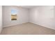 Bedroom featuring a large window and neutral colored carpeting at 5430 Flat Rock Pt, Stonecrest, GA 30038