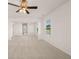 Spacious bedroom with carpet floors, a ceiling fan, and large windows with great natural light at 5430 Flat Rock Pt, Stonecrest, GA 30038